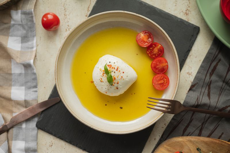Insalata Caprese with buffalo mozzarella and heirloom tomatoes