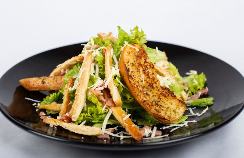 Caesar Salvatore salad with crispy croutons and Parmigiano